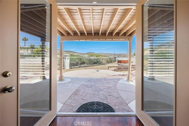 5 Vista Loreta, Lake Elsinore, CA 92532 - doorway to outside with plenty of natural light, wood ceiling, a mountain view, and wood finished floors