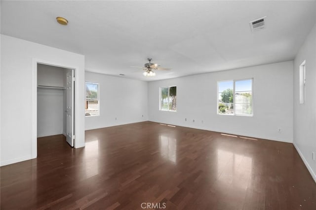 5 Vista Loreta, Lake Elsinore, CA 92532 - unfurnished bedroom featuring wood finished floors, a walk in closet, and ceiling fan