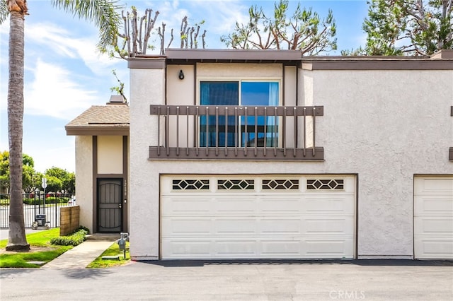 12698 Shearer Ln, Garden Grove, CA 92843 - townhome / multi-family property with a balcony, stucco siding, and a garage