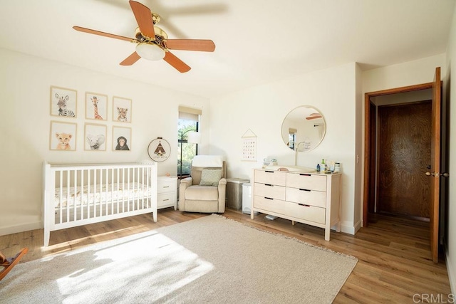 2278 Casitas Del Sol, Fallbrook, CA 92028 - bedroom with wood finished floors, a nursery area, and a ceiling fan