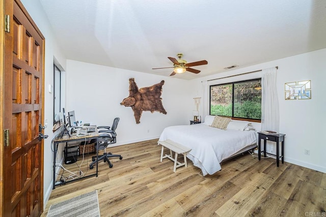 2278 Casitas Del Sol, Fallbrook, CA 92028 - bedroom featuring wood finished floors, a desk, and a ceiling fan