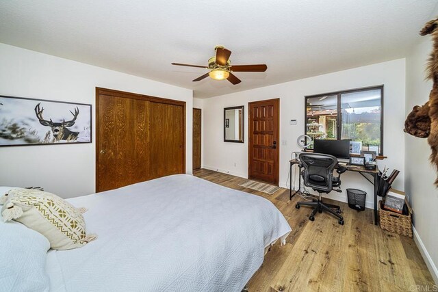2278 Casitas Del Sol, Fallbrook, CA 92028 - bedroom featuring wood finished floors, a closet, ceiling fan, and a desk