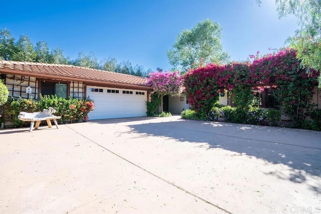 2278 Casitas Del Sol, Fallbrook, CA 92028 - view of front of house featuring a garage, concrete driveway, and a tile roof