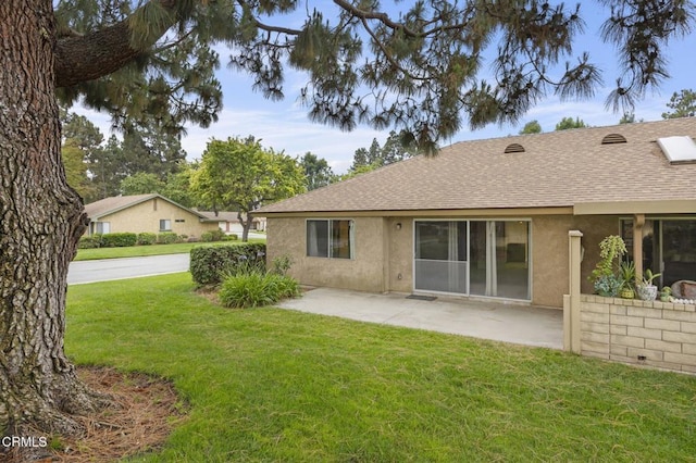 13208 Village 13 Unit 13, Camarillo, CA 93012 - rear view of house with a shingled roof, stucco siding, a yard, and a patio area