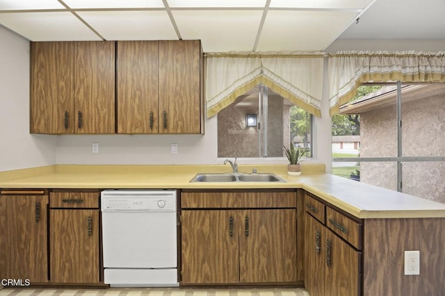 13208 Village 13 Unit 13, Camarillo, CA 93012 - kitchen with white dishwasher, light countertops, and brown cabinets