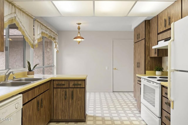 13208 Village 13 Unit 13, Camarillo, CA 93012 - kitchen featuring white appliances, light floors, under cabinet range hood, and light countertops