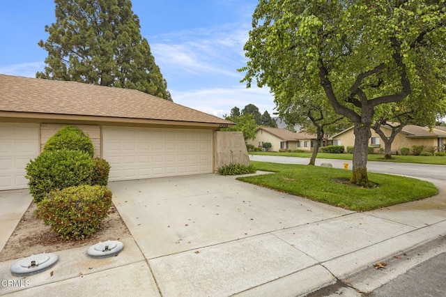13208 Village 13 Unit 13, Camarillo, CA 93012 - view of front of home with a garage, a shingled roof, and driveway