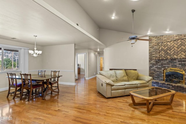 30100 Sunland Way, Tehachapi, CA 93561 - living area with light wood finished floors, a brick fireplace, ceiling fan, a chandelier, and recessed lighting
