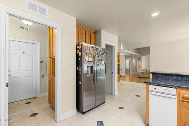 30100 Sunland Way, Tehachapi, CA 93561 - kitchen with stainless steel refrigerator with ice dispenser, light tile patterned floors, dark countertops, open floor plan, and recessed lighting