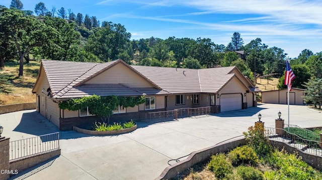 30100 Sunland Way, Tehachapi, CA 93561 - single story home featuring a tiled roof, an attached garage, concrete driveway, and brick siding
