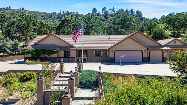 30100 Sunland Way, Tehachapi, CA 93561 - single story home featuring a tile roof, an attached garage, and driveway