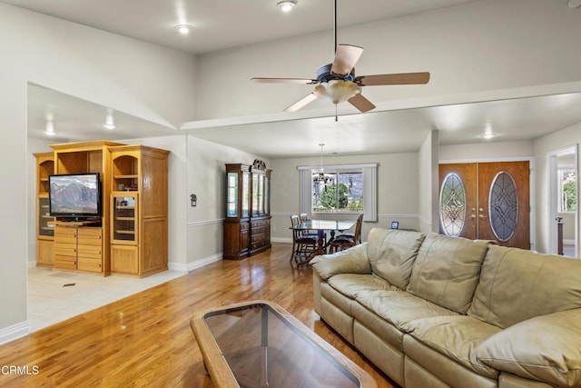 30100 Sunland Way, Tehachapi, CA 93561 - living room featuring light wood-style floors, ceiling fan, and plenty of natural light