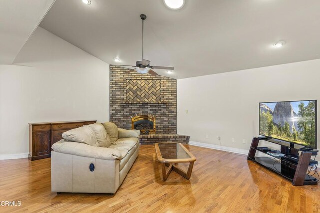 30100 Sunland Way, Tehachapi, CA 93561 - living room with lofted ceiling, a ceiling fan, light wood-style flooring, a fireplace, and recessed lighting