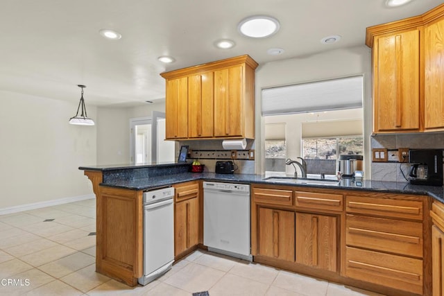 30100 Sunland Way, Tehachapi, CA 93561 - kitchen featuring white dishwasher, tasteful backsplash, a peninsula, brown cabinets, and recessed lighting