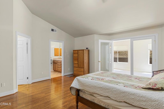 30100 Sunland Way, Tehachapi, CA 93561 - bedroom with wood finished floors, lofted ceiling, and connected bathroom
