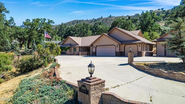 30100 Sunland Way, Tehachapi, CA 93561 - single story home with a garage, driveway, a tile roof, and a mountain view