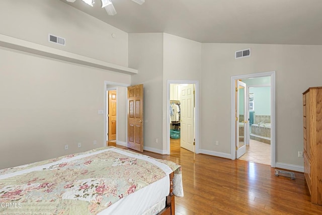 30100 Sunland Way, Tehachapi, CA 93561 - bedroom featuring wood finished floors, a spacious closet, high vaulted ceiling, a ceiling fan, and ensuite bathroom