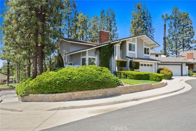 1943 Horseshoe Cir, Placentia, CA 92870 - view of front of property featuring a chimney, stucco siding, and driveway