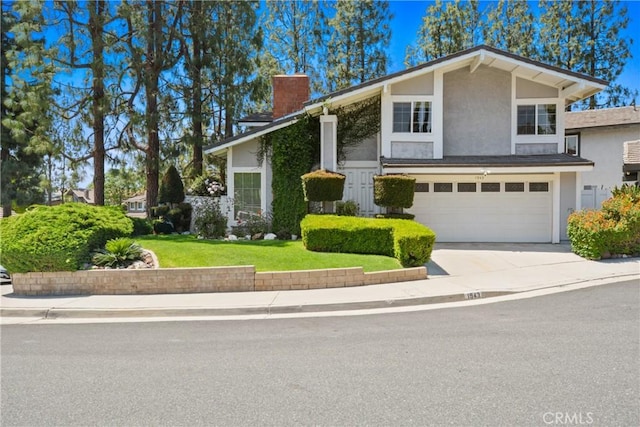 1943 Horseshoe Cir, Placentia, CA 92870 - view of front facade with a chimney, concrete driveway, stucco siding, an attached garage, and a front lawn
