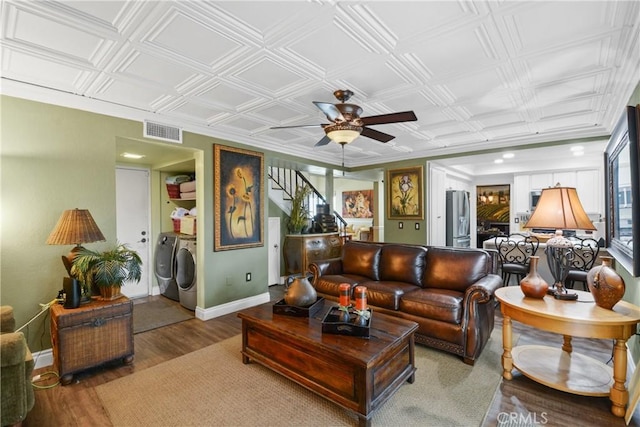 1943 Horseshoe Cir, Placentia, CA 92870 - living room featuring washer and dryer, a ceiling fan, wood finished floors, an ornate ceiling, and stairs