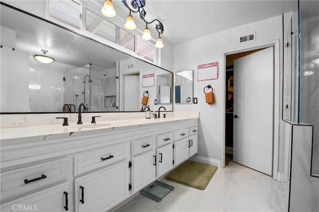 1943 Horseshoe Cir, Placentia, CA 92870 - bathroom with marble look tile flooring, double vanity, a marble finish shower, and a spacious closet