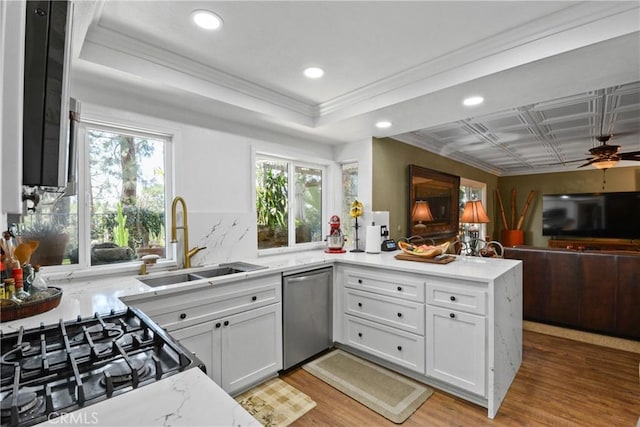 1943 Horseshoe Cir, Placentia, CA 92870 - kitchen with dishwasher, a peninsula, crown molding, white cabinetry, and open floor plan