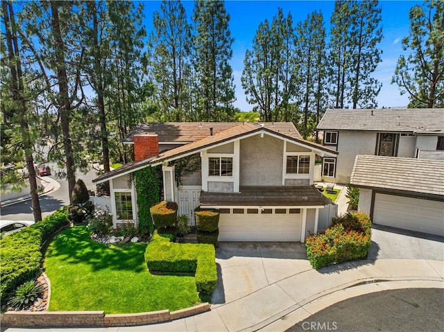 1943 Horseshoe Cir, Placentia, CA 92870 - view of front facade with stucco siding, concrete driveway, a garage, a chimney, and a front lawn