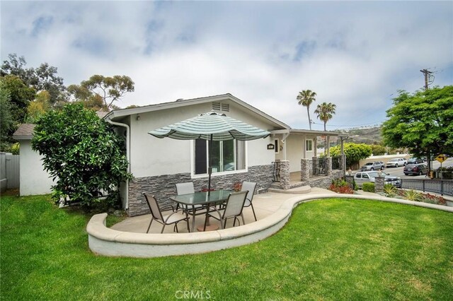 1413 Avenida De La Estrella, San Clemente, CA 92672 - rear view of house with stone siding, stucco siding, and a patio area