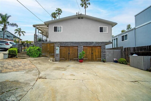 1413 Avenida De La Estrella, San Clemente, CA 92672 - back of house with stone siding, stucco siding, and stairs