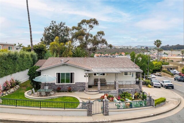 1413 Avenida De La Estrella, San Clemente, CA 92672 - view of front of home featuring stucco siding, a fenced front yard, and stone siding