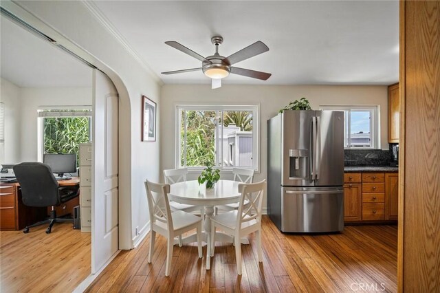 1413 Avenida De La Estrella, San Clemente, CA 92672 - dining space featuring healthy amount of natural light, light wood finished floors, a ceiling fan, and arched walkways