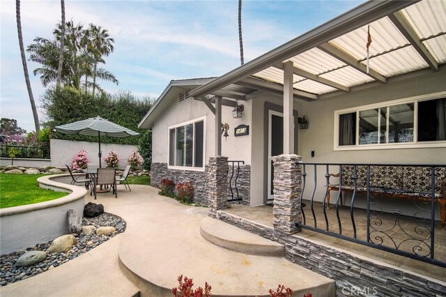 1413 Avenida De La Estrella, San Clemente, CA 92672 - entrance to property with stucco siding, outdoor dining space, stone siding, and a patio