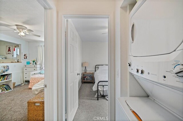 1413 Avenida De La Estrella, San Clemente, CA 92672 - laundry room featuring stacked washer and clothes dryer, carpet floors, and ceiling fan
