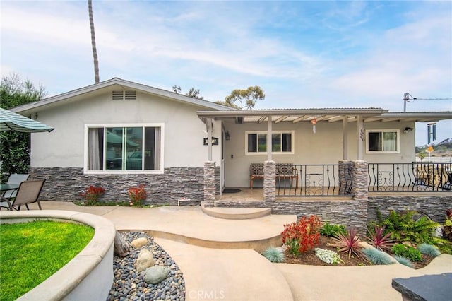 1413 Avenida De La Estrella, San Clemente, CA 92672 - view of front of home with stucco siding, a patio area, and stone siding