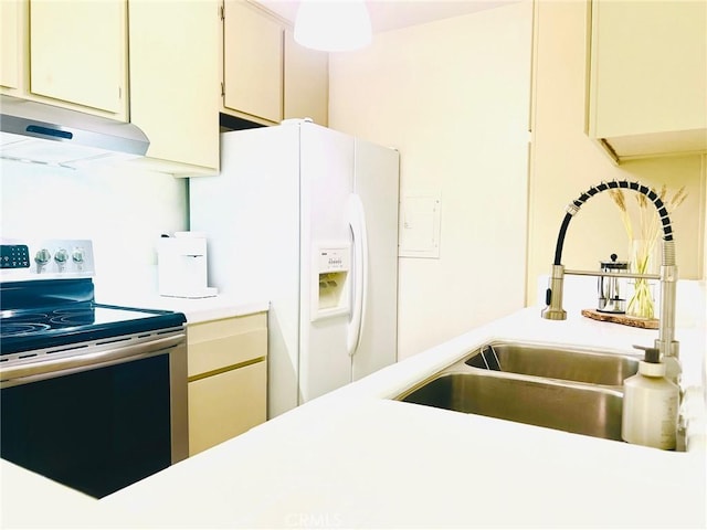 23515 Lyons Ave Unit 232, Valencia, CA 91355 - kitchen featuring electric range oven, range hood, white refrigerator with ice dispenser, light countertops, and cream cabinetry