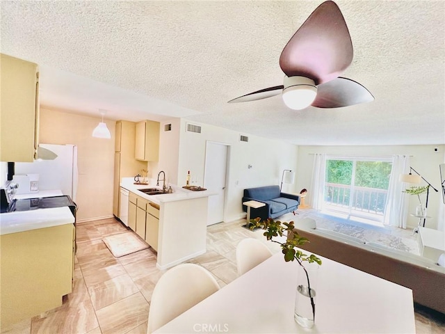 23515 Lyons Ave Unit 232, Valencia, CA 91355 - kitchen featuring light countertops, ceiling fan, white appliances, open floor plan, and a textured ceiling