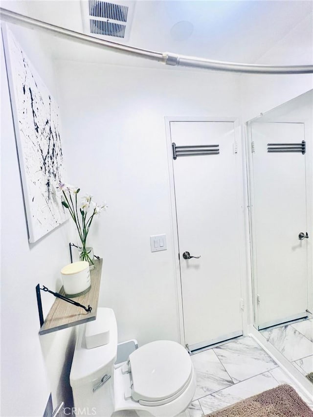 23515 Lyons Ave Unit 232, Valencia, CA 91355 - bathroom featuring toilet and marble finish floors
