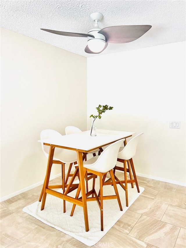 23515 Lyons Ave Unit 232, Valencia, CA 91355 - dining space with a textured ceiling and a ceiling fan