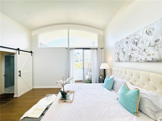 4723 La Villa Marina Unit F, Marina Del Rey, CA 90292 - bedroom with access to exterior, wood finished floors, a barn door, and lofted ceiling