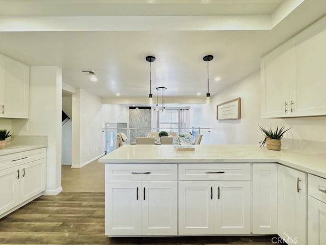 4723 La Villa Marina Unit F, Marina Del Rey, CA 90292 - kitchen with white cabinetry, a peninsula, dark wood-style floors, decorative light fixtures, and light countertops