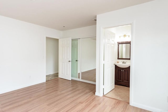 522 Garfield St, Oceanside, CA 92054 - unfurnished bedroom with light wood-style flooring, connected bathroom, and a closet