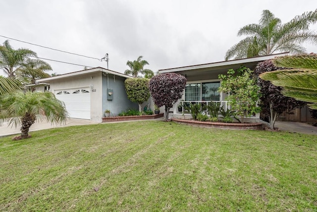 522 Garfield St, Oceanside, CA 92054 - view of front of house featuring a garage, stucco siding, a front lawn, and driveway