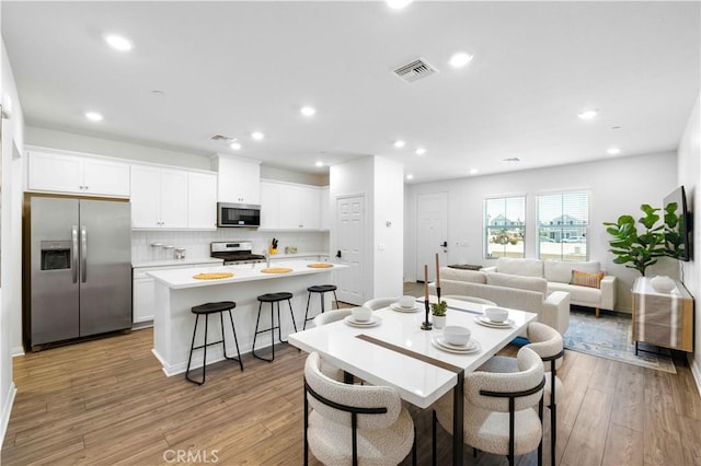 3957 E Huntington St, Ontario, CA 91761 - dining room featuring light wood-style floors and recessed lighting