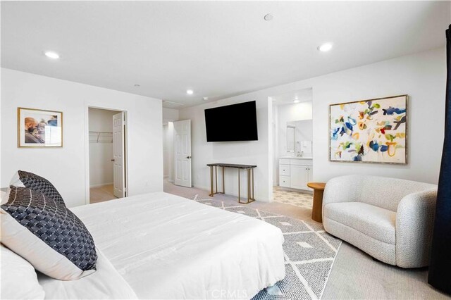 3957 E Huntington St, Ontario, CA 91761 - bedroom featuring recessed lighting, a spacious closet, and connected bathroom