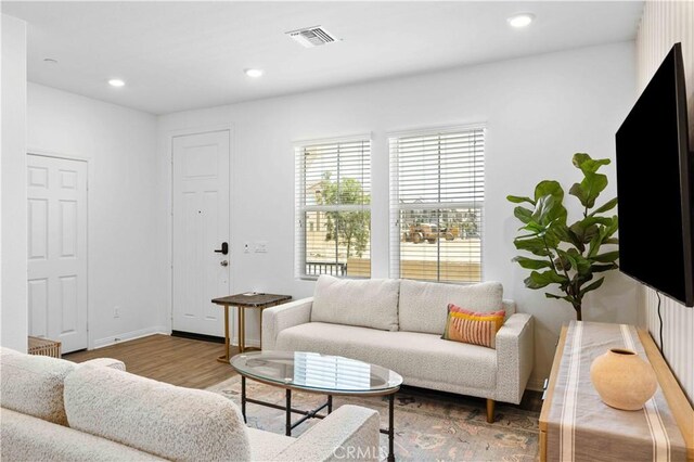 3957 E Huntington St, Ontario, CA 91761 - living area featuring wood finished floors and recessed lighting