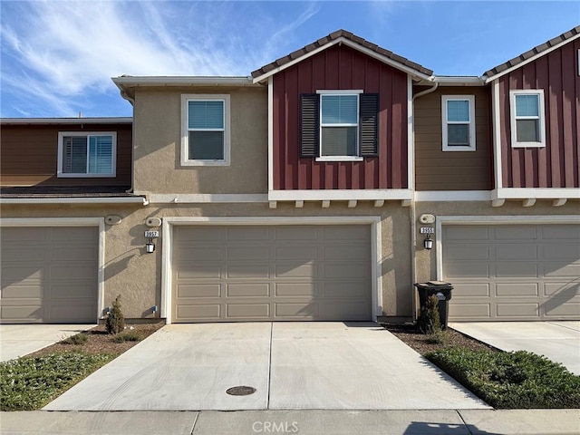 3957 E Huntington St, Ontario, CA 91761 - multi unit property with board and batten siding, stucco siding, a garage, and a tiled roof