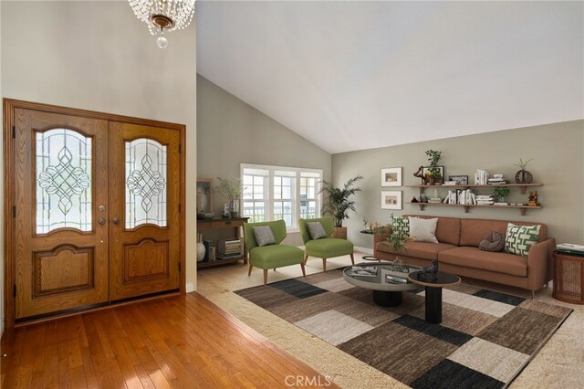 3832 Holden Cir, Los Alamitos, CA 90720 - foyer with high vaulted ceiling, wood-type flooring, and french doors