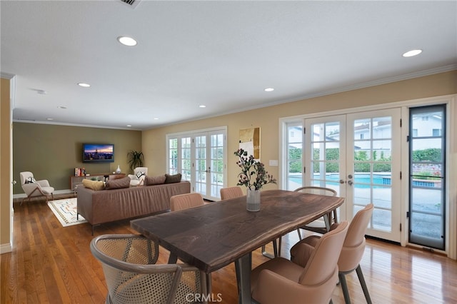 3832 Holden Cir, Los Alamitos, CA 90720 - dining room featuring french doors, ornamental molding, wood finished floors, and recessed lighting