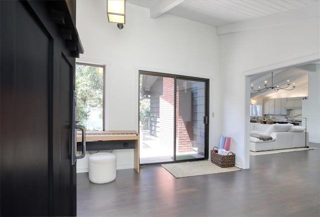 2103 Benson Ave, Cambria, CA 93428 - interior space with beam ceiling, a chandelier, wood finished floors, and high vaulted ceiling