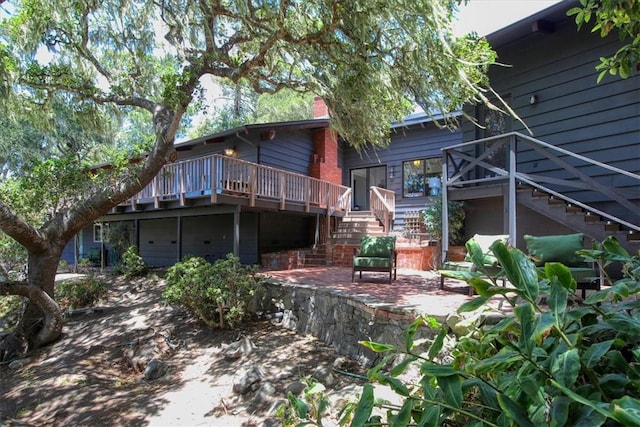 2103 Benson Ave, Cambria, CA 93428 - back of house featuring stairway, a deck, and a patio